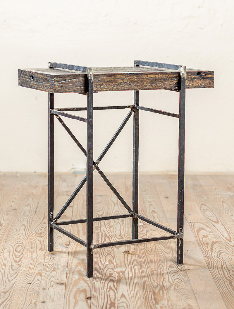 Why show boxcar wood in  your pictures for the Meridian Side Hand-Forged Iron Table when it is not even an option?